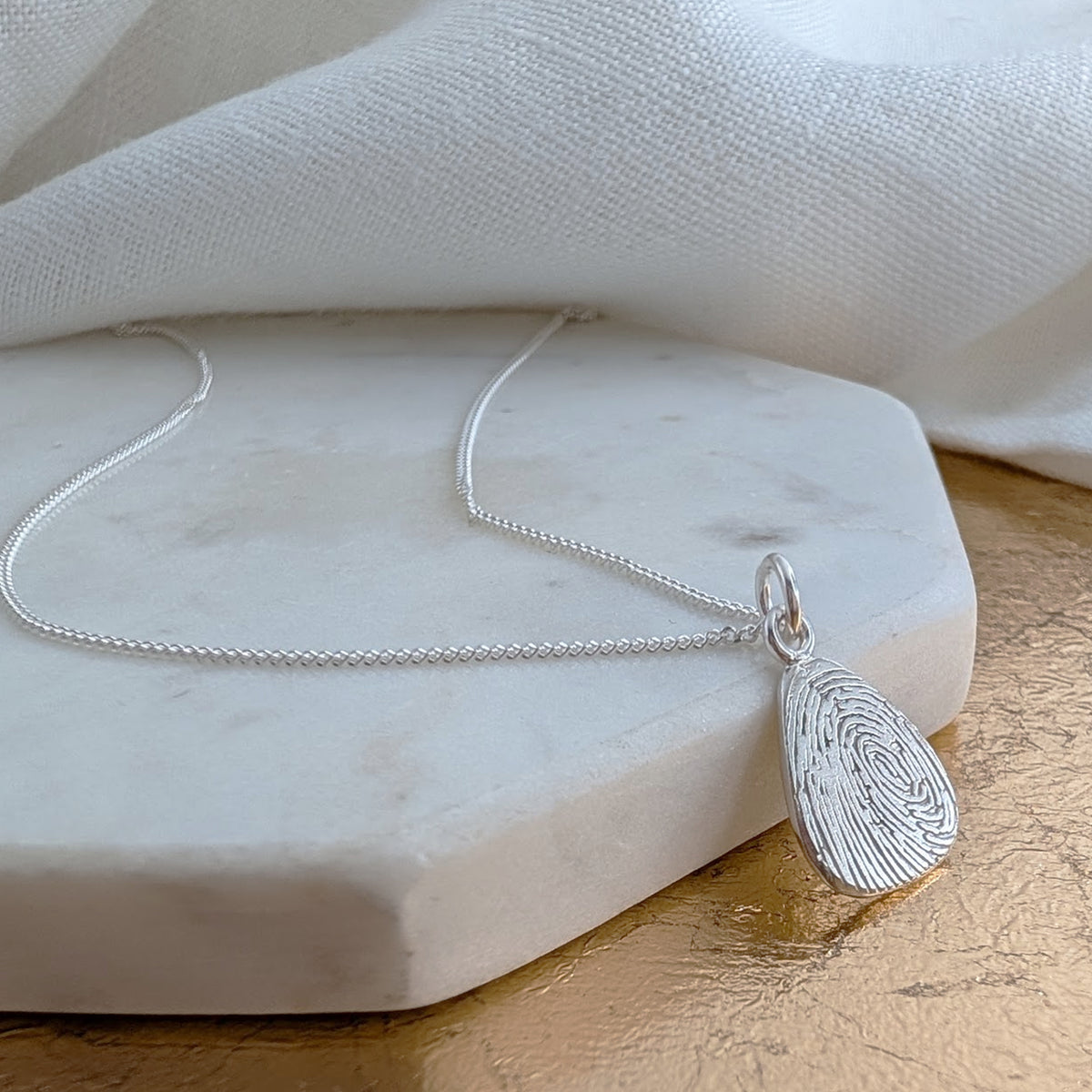 DAINTY DROPLET FINGERPRINT CHARM