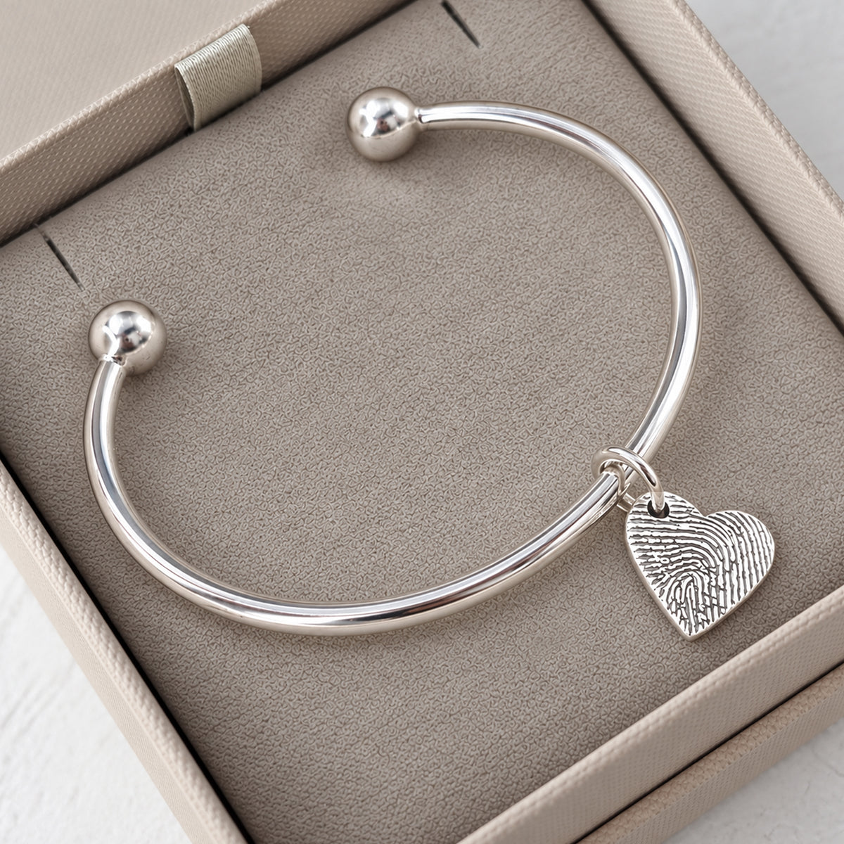 FINGERPRINT CHARM TORQUE BANGLE