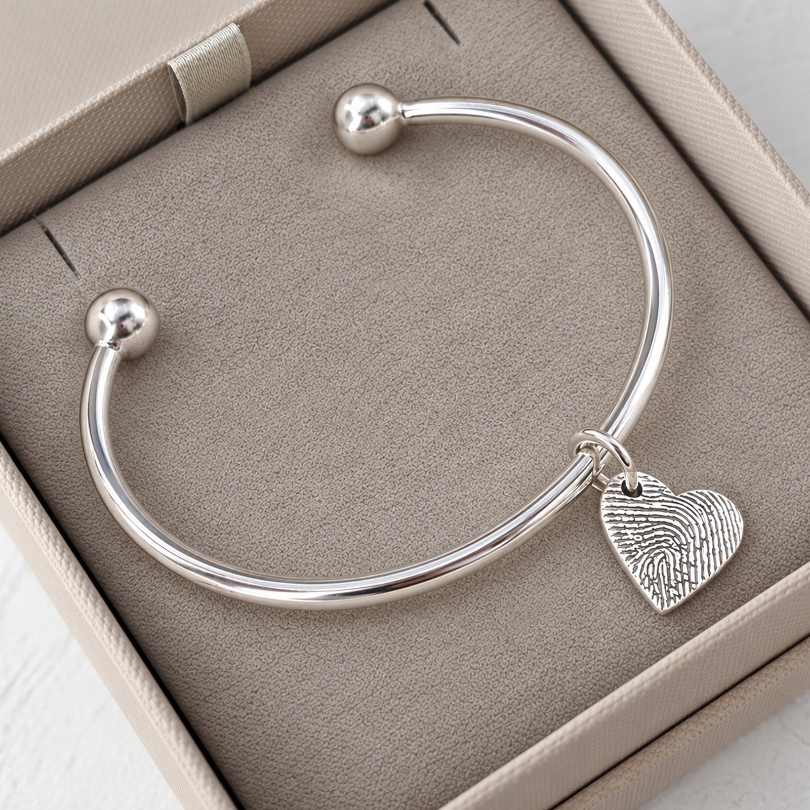 FINGERPRINT CHARM TORQUE BANGLE