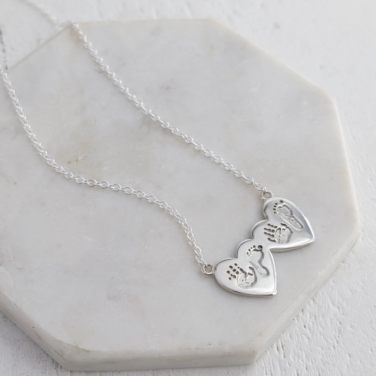 Silver necklace engraved with baby's hand and footprints - multiiple children's prints