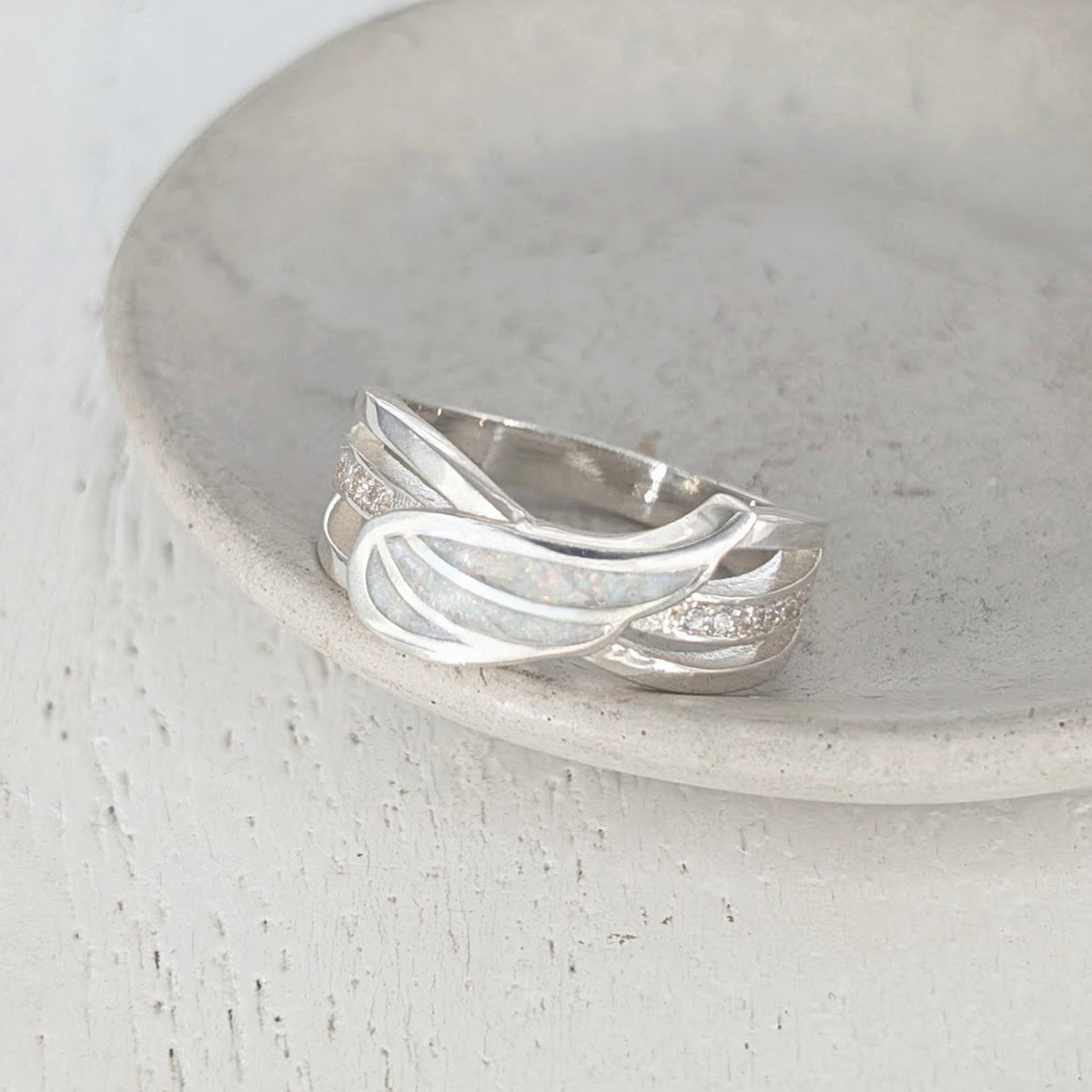 Angel wing memorial ashes ring in sterling silver with sparkling CZ stones