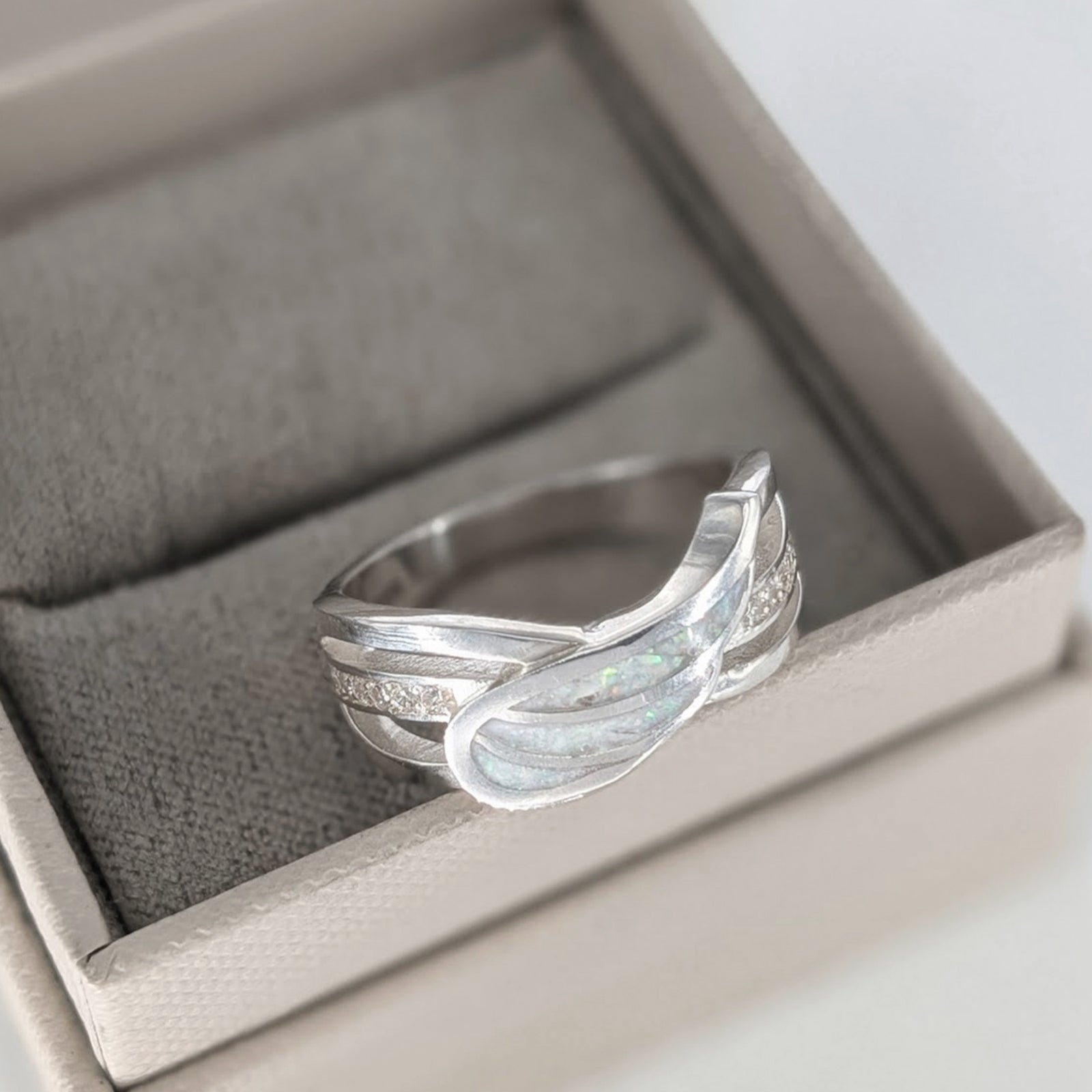 Sterling silver angel wing cremation ashes ring with cubic zirconia detail