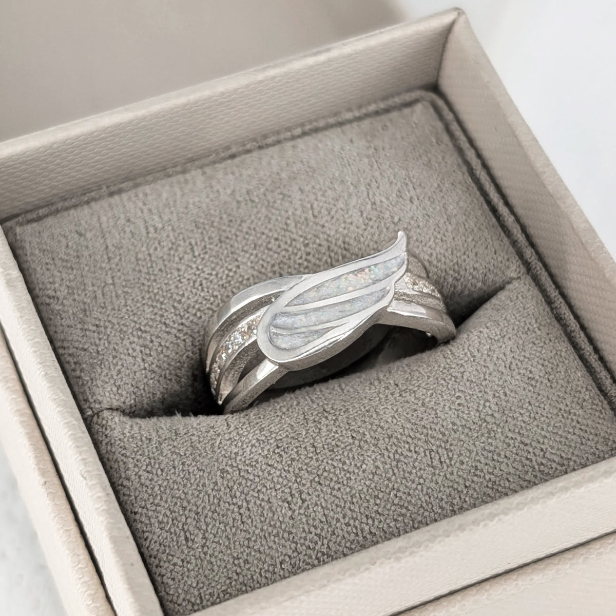 Cremation ashes angel wing ring in sterling silver for a loved one’s ashes