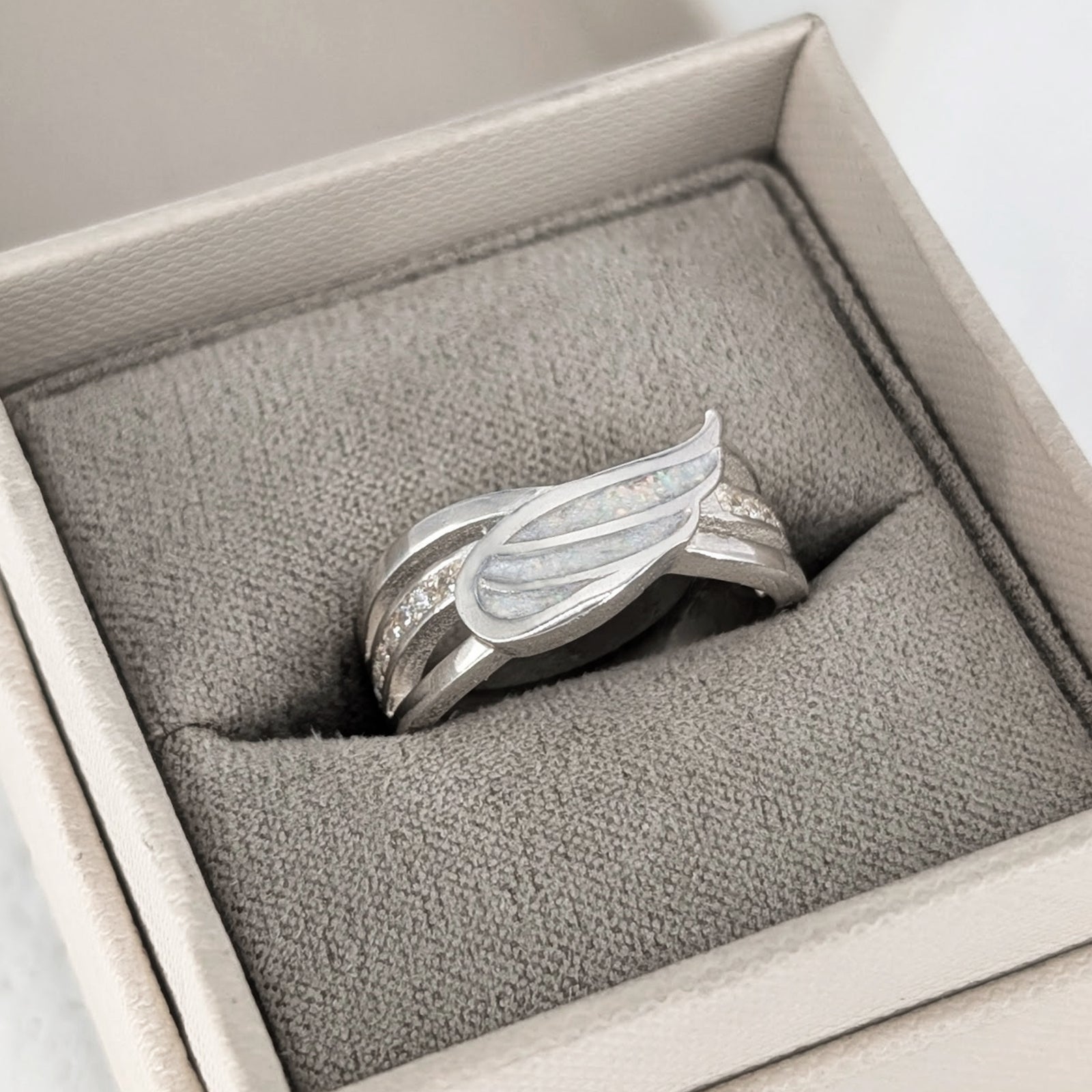 Cremation ashes angel wing ring in sterling silver for a loved one’s ashes