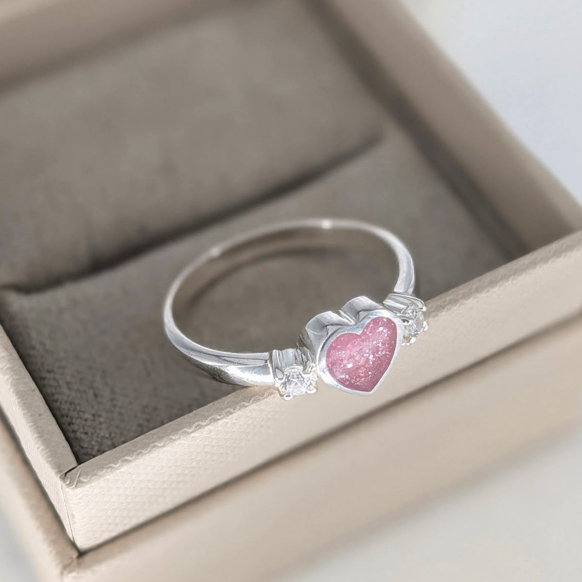 Sterling silver heart cremation ashes ring with sparkling cubic zirconia stones