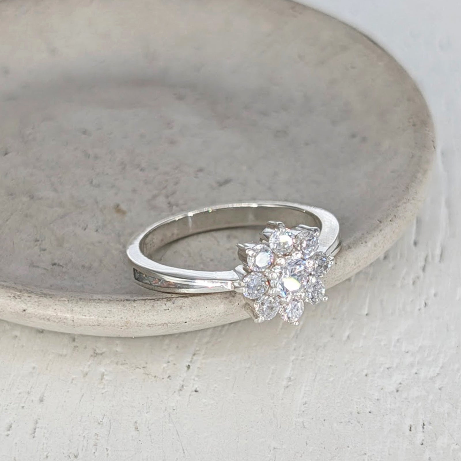 Sterling silver cremation ashes ring with sparkling cubic zirconia cluster