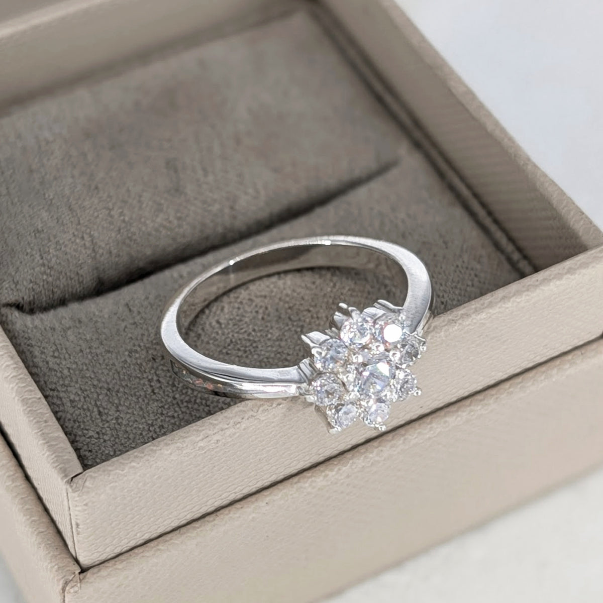 Sterling silver ring for loved one’s cremation ashes with sparkling CZ detail