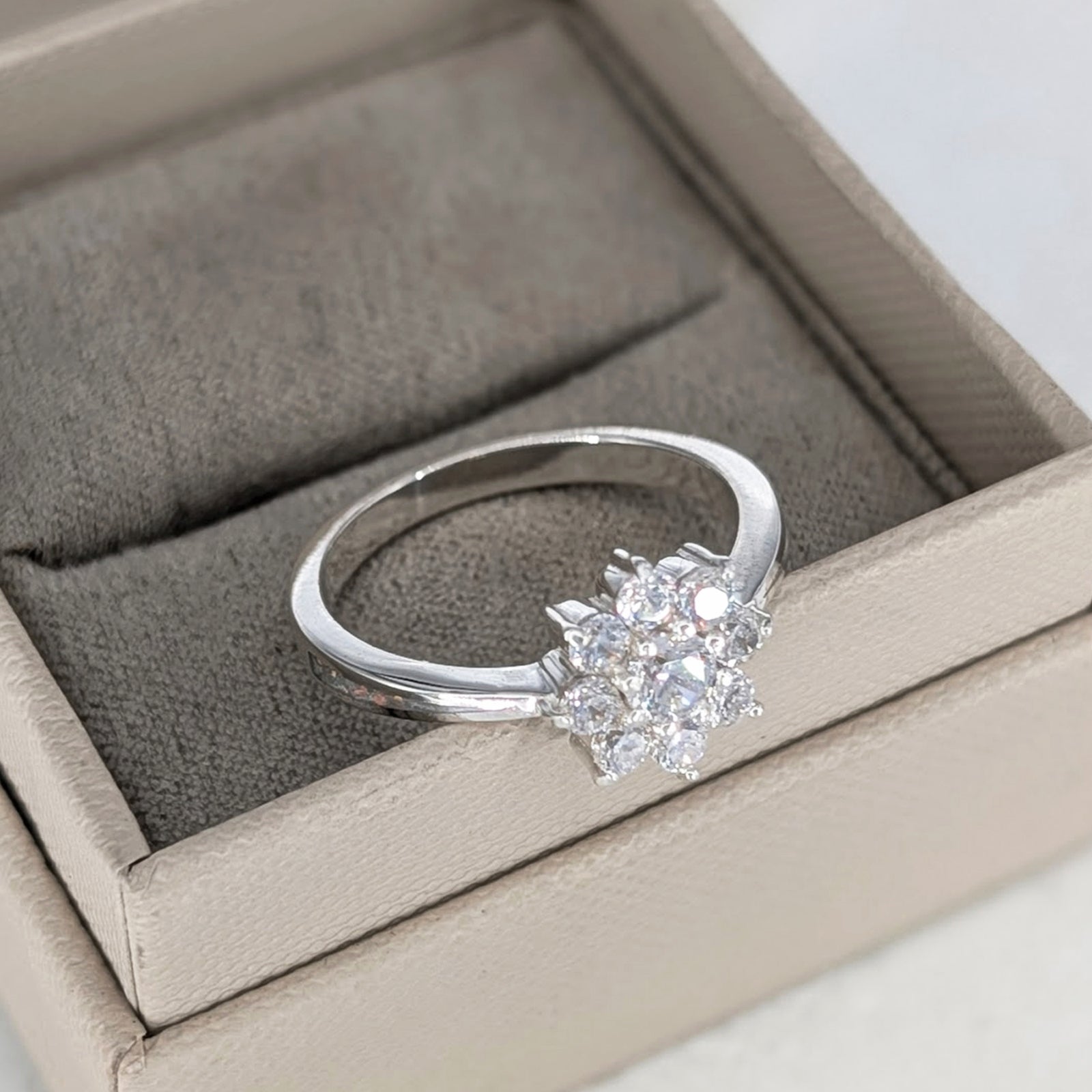 Sterling silver ring for loved one’s cremation ashes with sparkling CZ detail