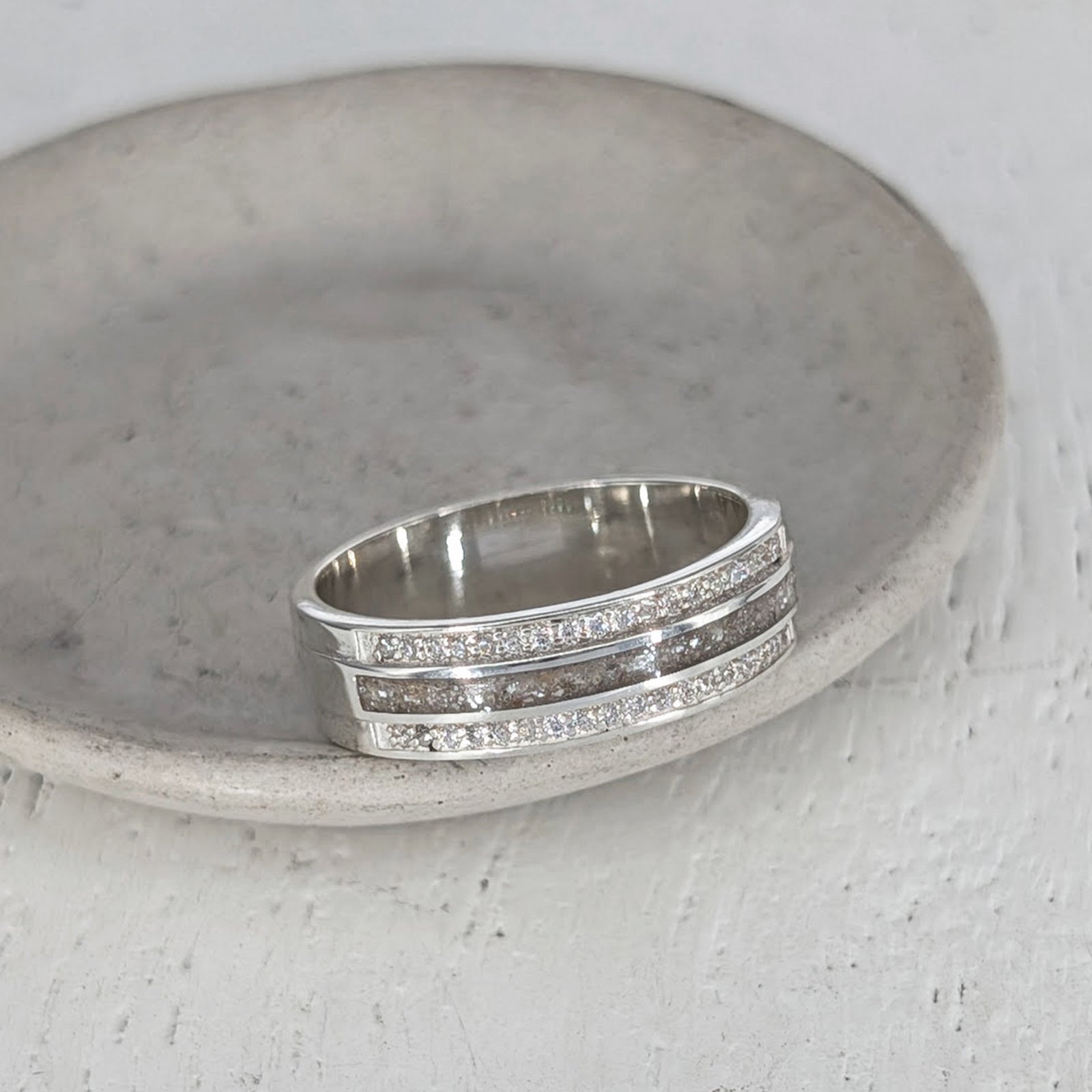 Sterling silver cremation ashes ring with sparkling cubic zirconia bands