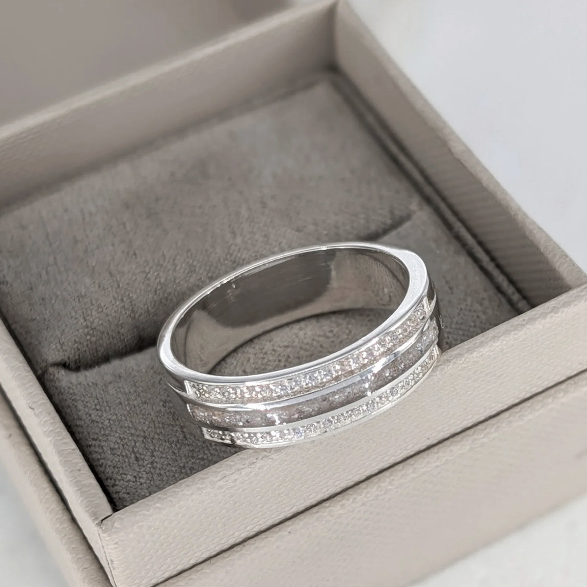Sterling silver cremation ashes ring with sparkling cubic zirconia bands