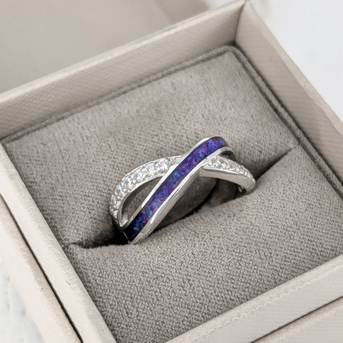 Sterling silver cremation ashes ring with cubic zirconia crossover design