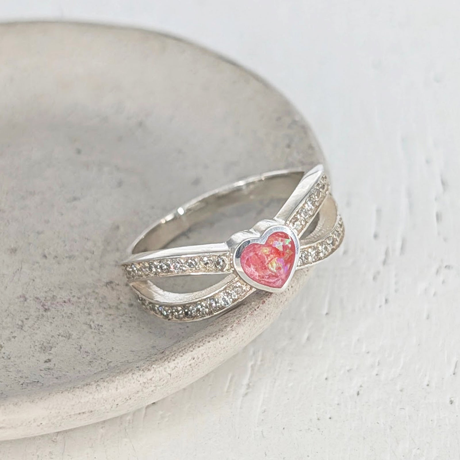 Sterling silver heart cremation ashes ring with sparkling cubic zirconia crossover bands