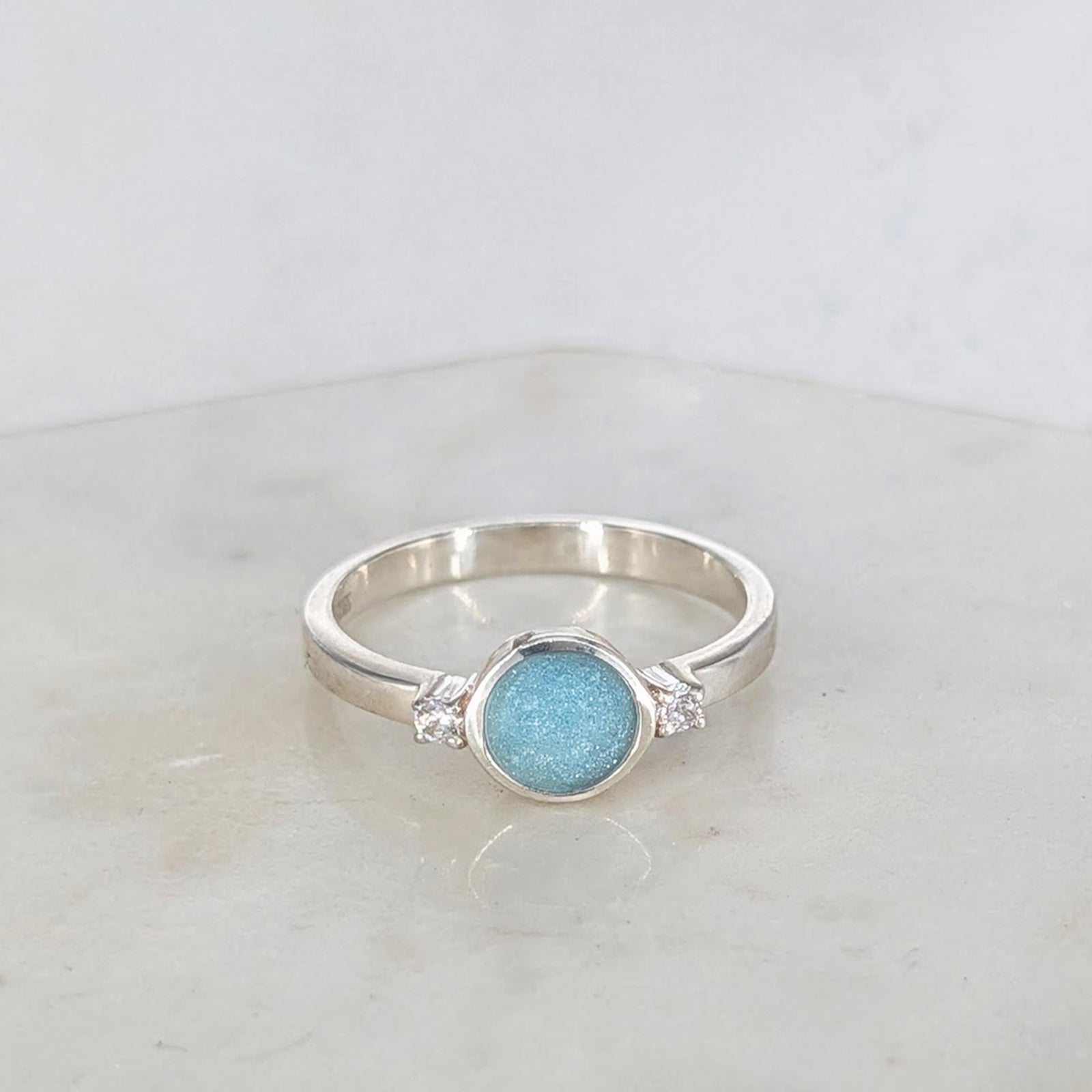 Sterling silver cremation ashes ring with blue opal and sparkling cubic zirconia stones