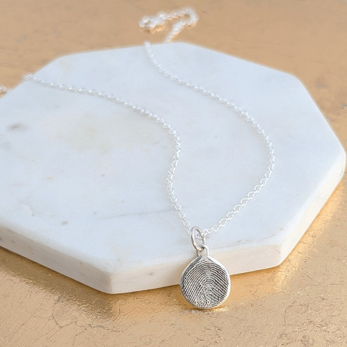 MOLTEN FINGERPRINT CHARM