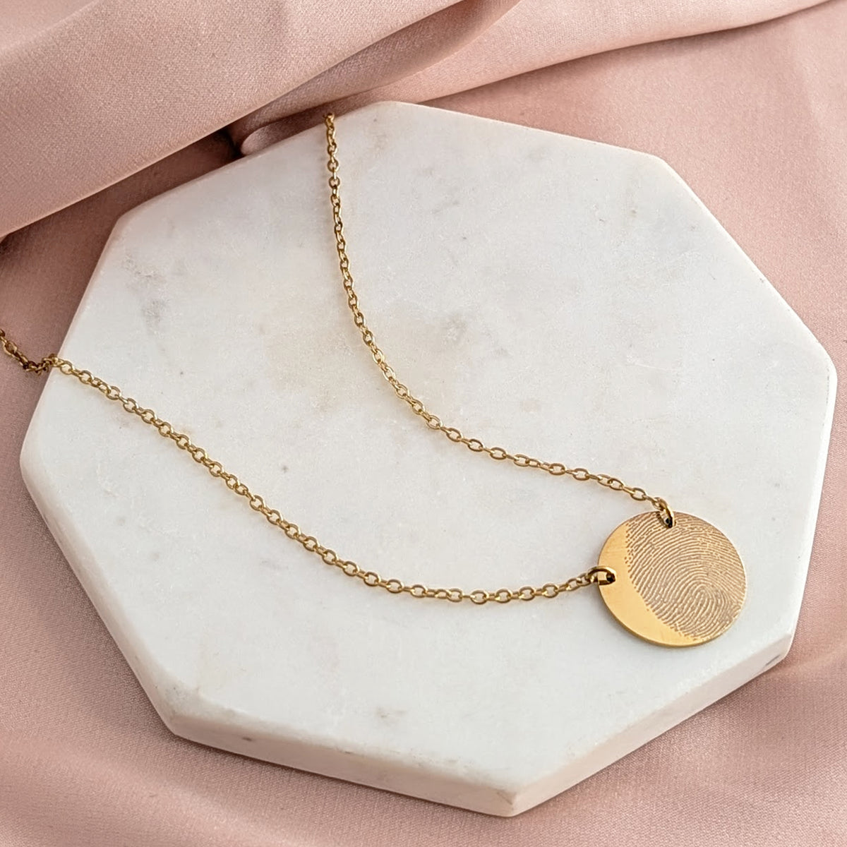 Gold steel fingerprint pendant necklace personalised from a loved one’s fingerprint, memorial keepsake jewellery