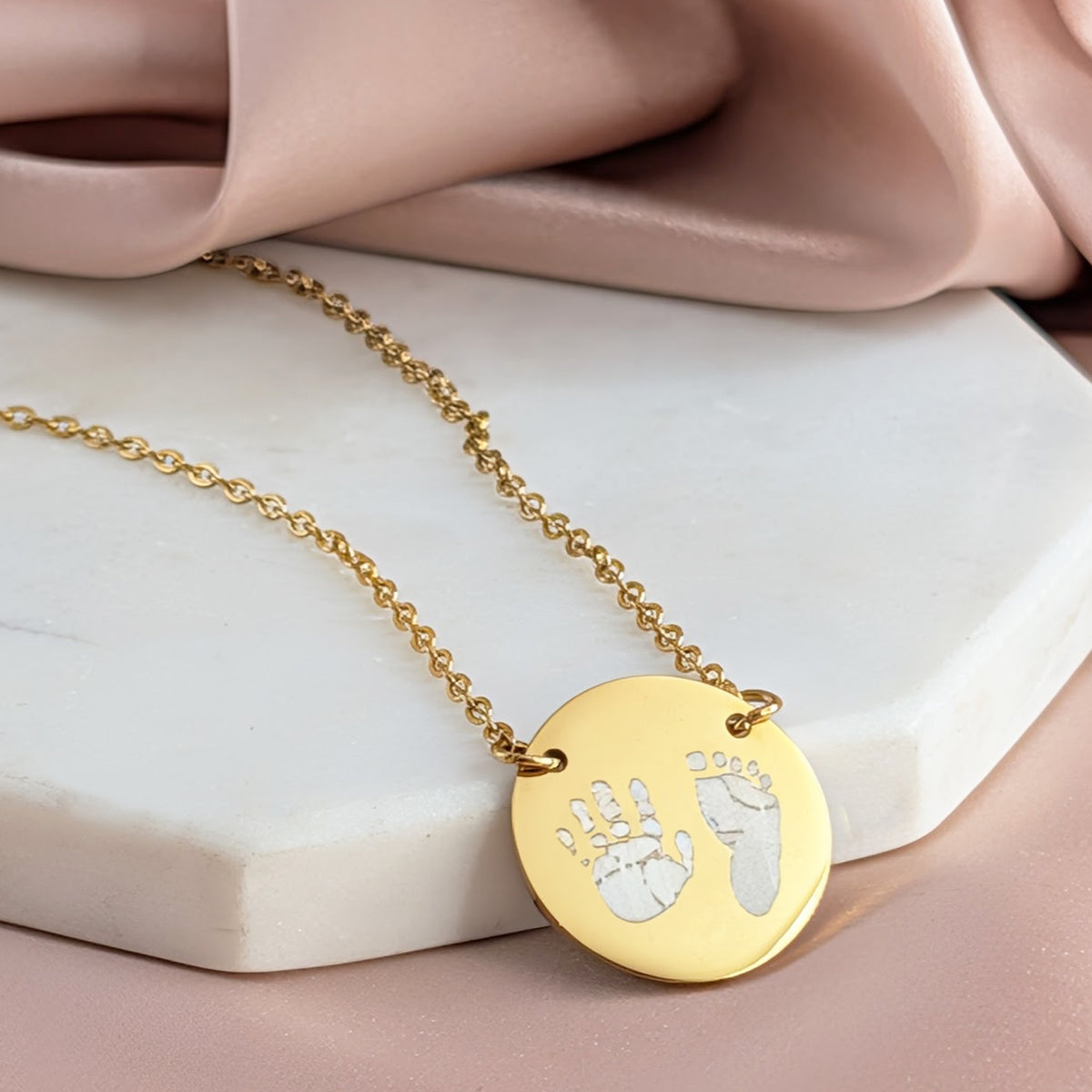 Personalised baby handprint and footprint necklace in gold stainless steel disc pendant