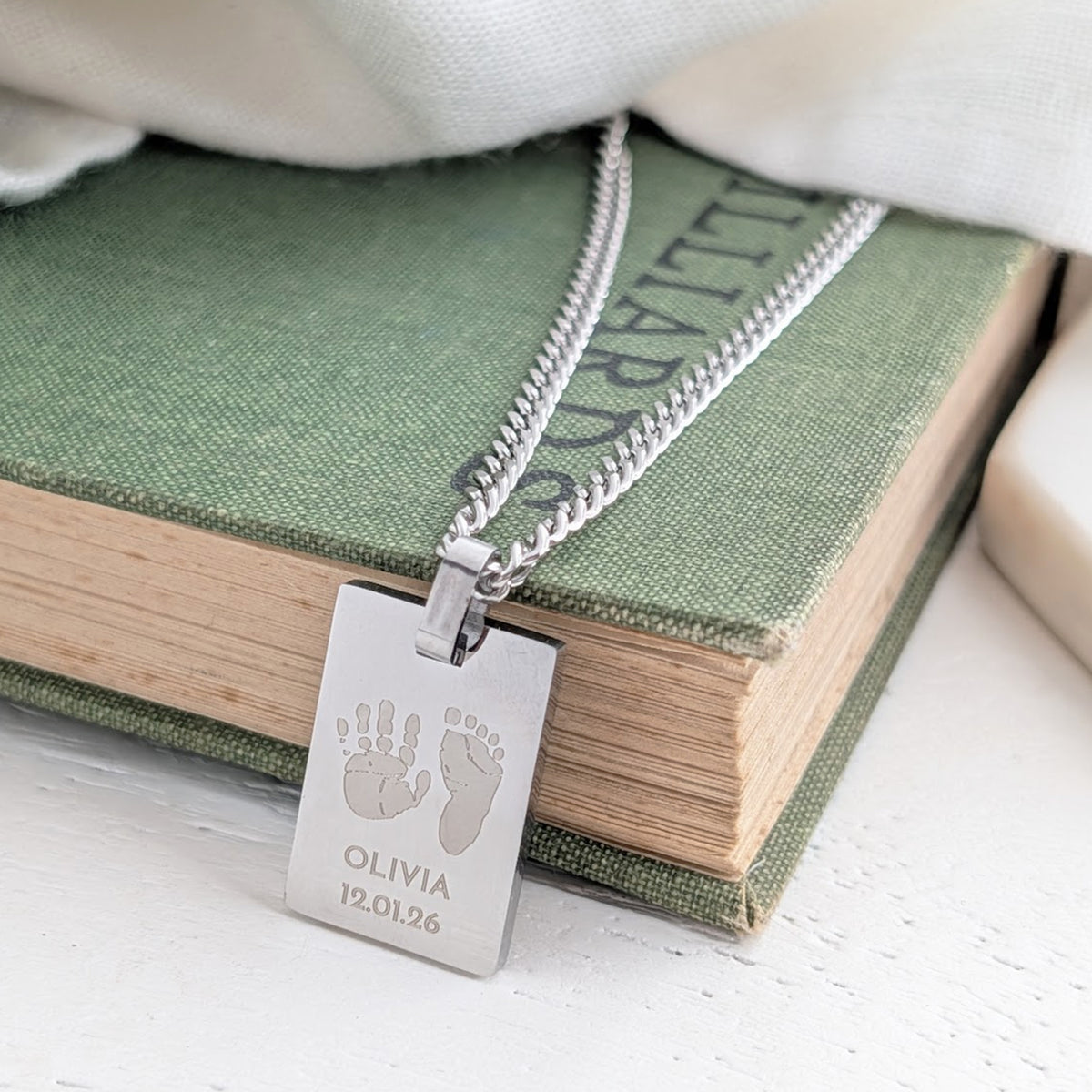 Personalised silver baby hand and footprint tag necklace with engraved name and date