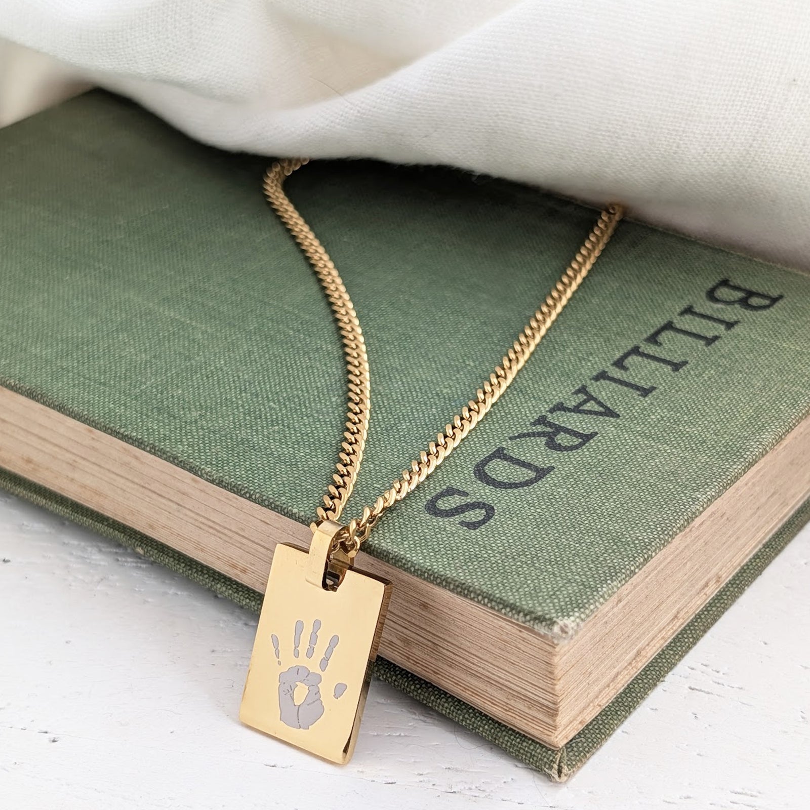 Personalised silver baby hand and footprint tag necklace with engraved name and date