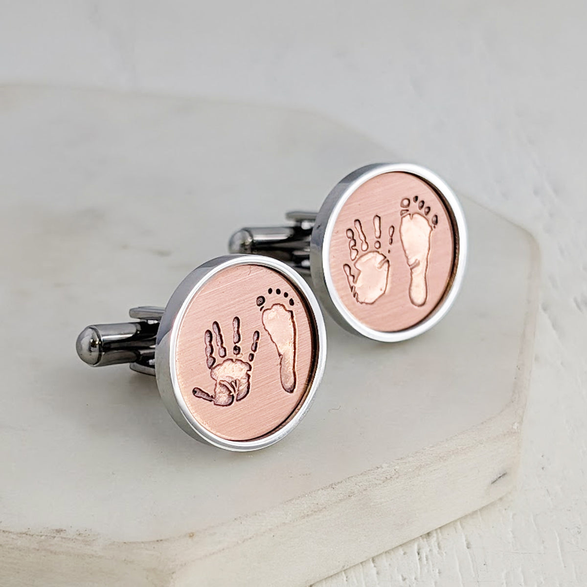 stainless steel and copper cuffinks engraved with your childs own unique handprint and footprint