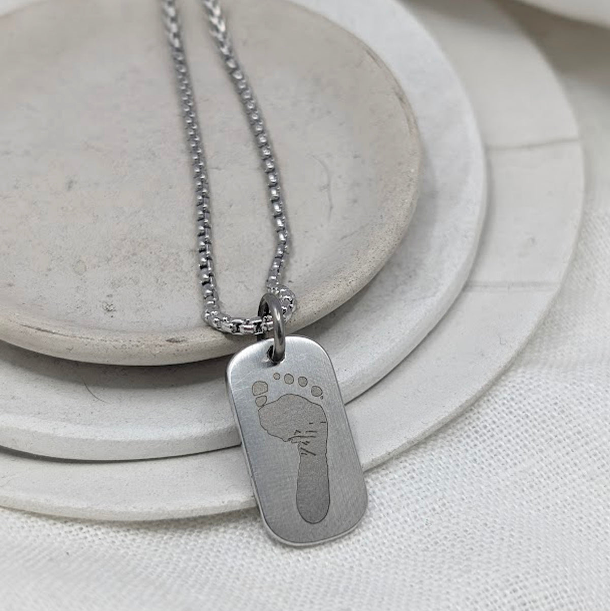 FOOTPRINT STEEL SMALL DOG TAG NECKLACE