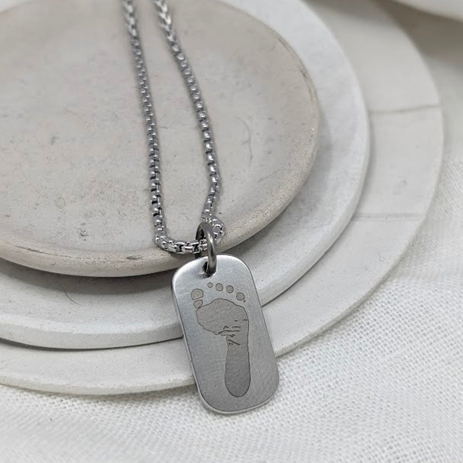 FOOTPRINT STEEL SMALL DOG TAG NECKLACE