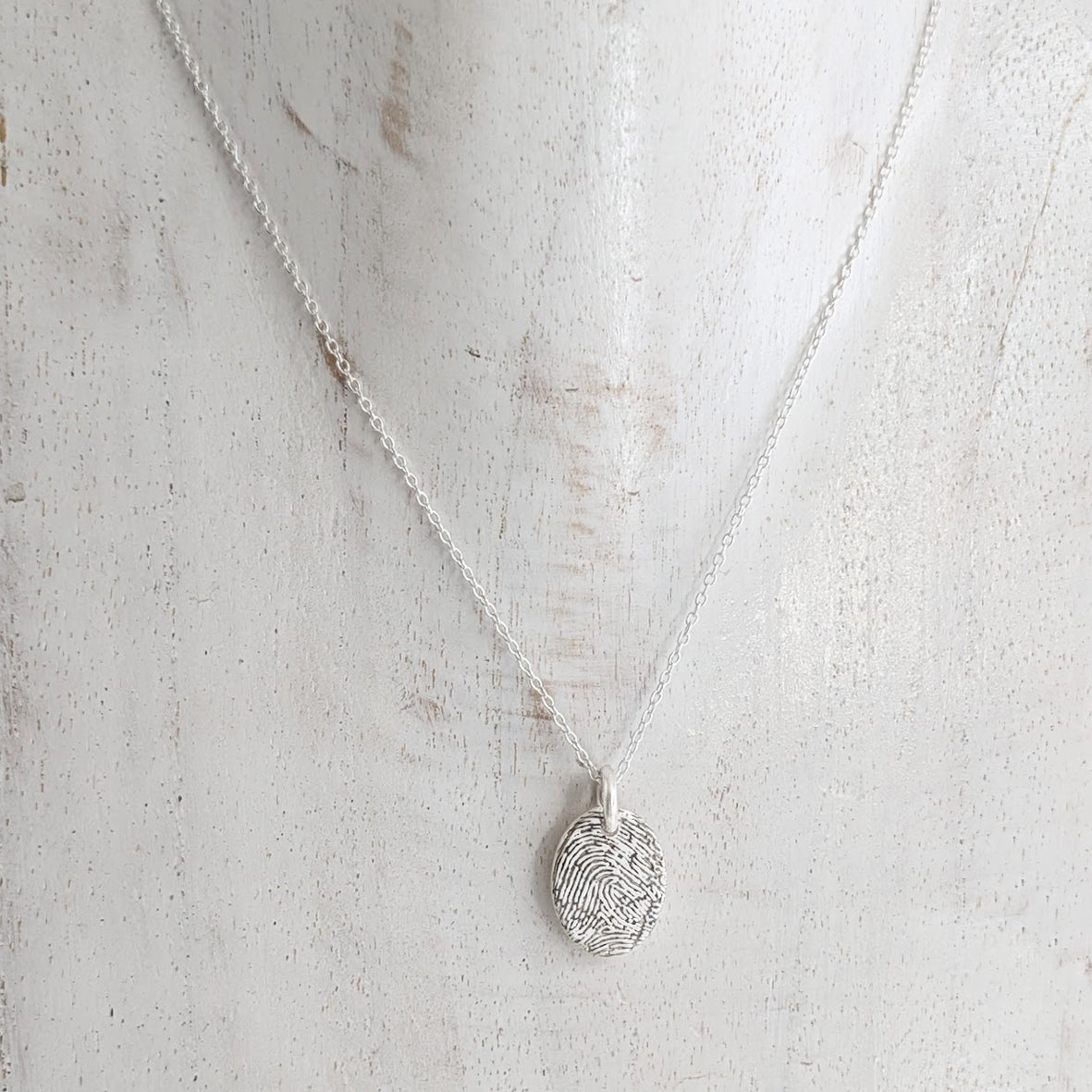FINGERPRINT OVAL CHARM