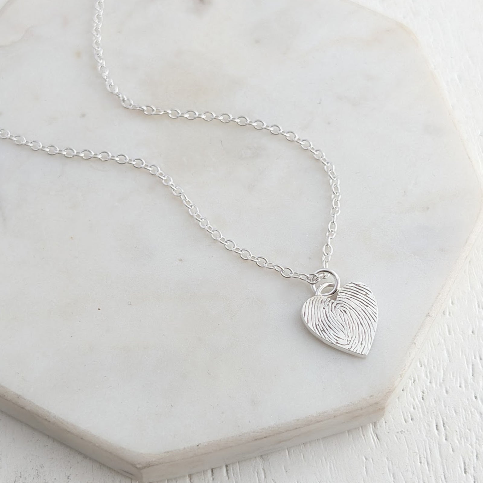 Silver fingerprint heart charm