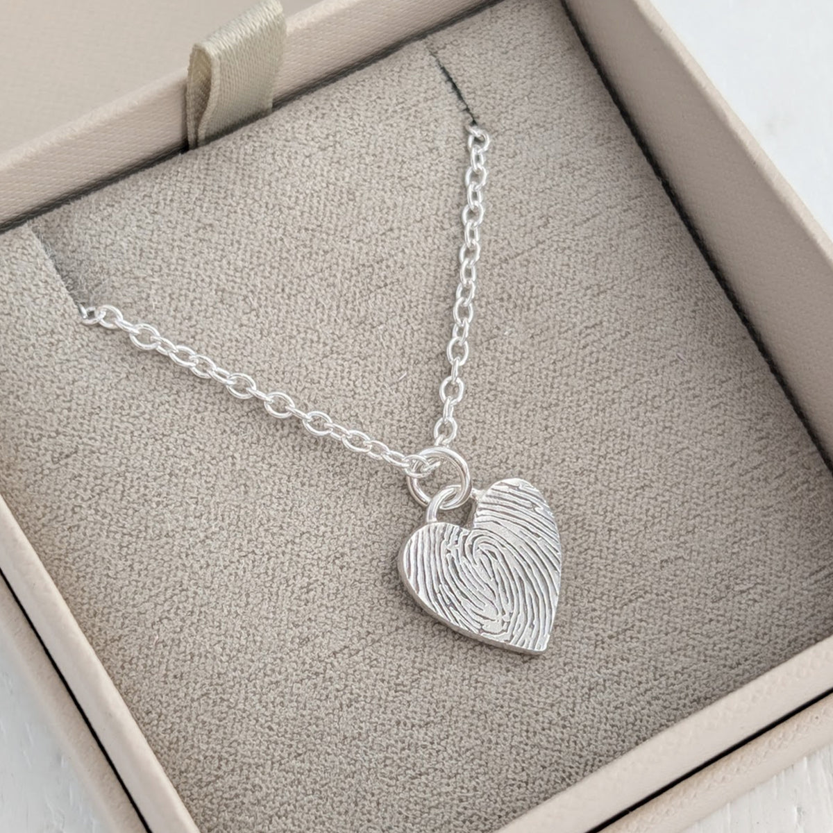 Silver fingerprint heart charm