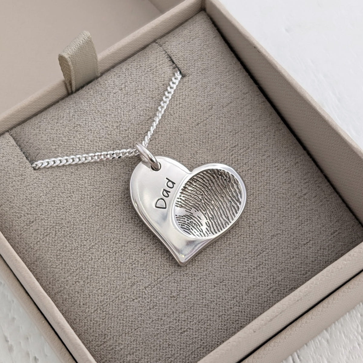 Fingerprint jewellery - their true touch captured in silver or gold