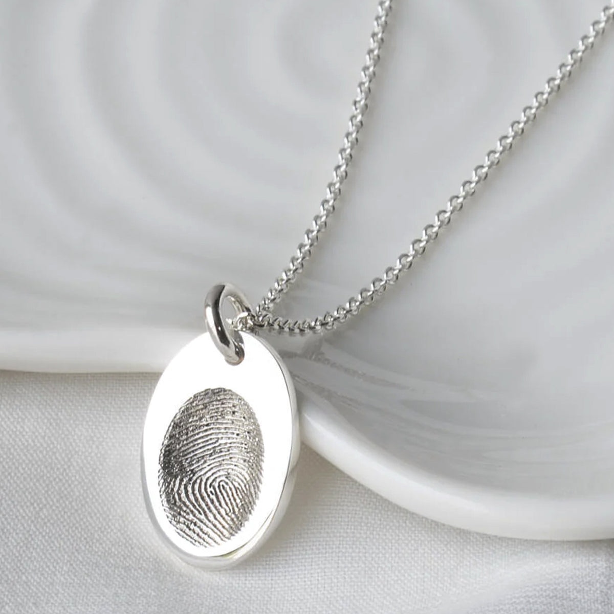 Silver fingerprint impression oval charm