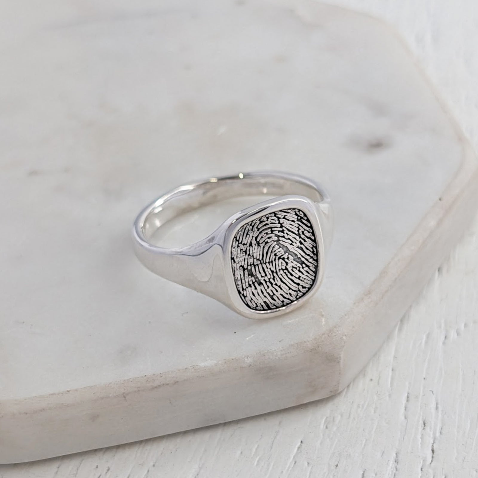 Sterling silver signet ring engraved with a fingerprint