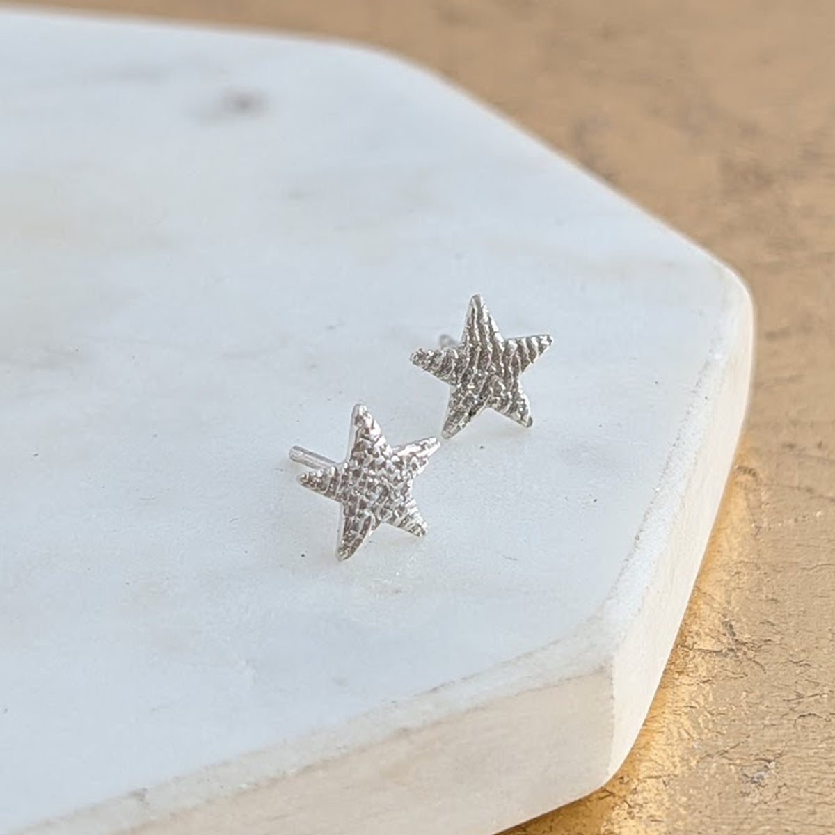 Fingerprint Star Stud Earrings in Silver or Gold – Delicate personalised star stud earrings engraved with a real fingerprint. Handmade in sterling silver or solid gold as a meaningful keepsake jewellery gift.