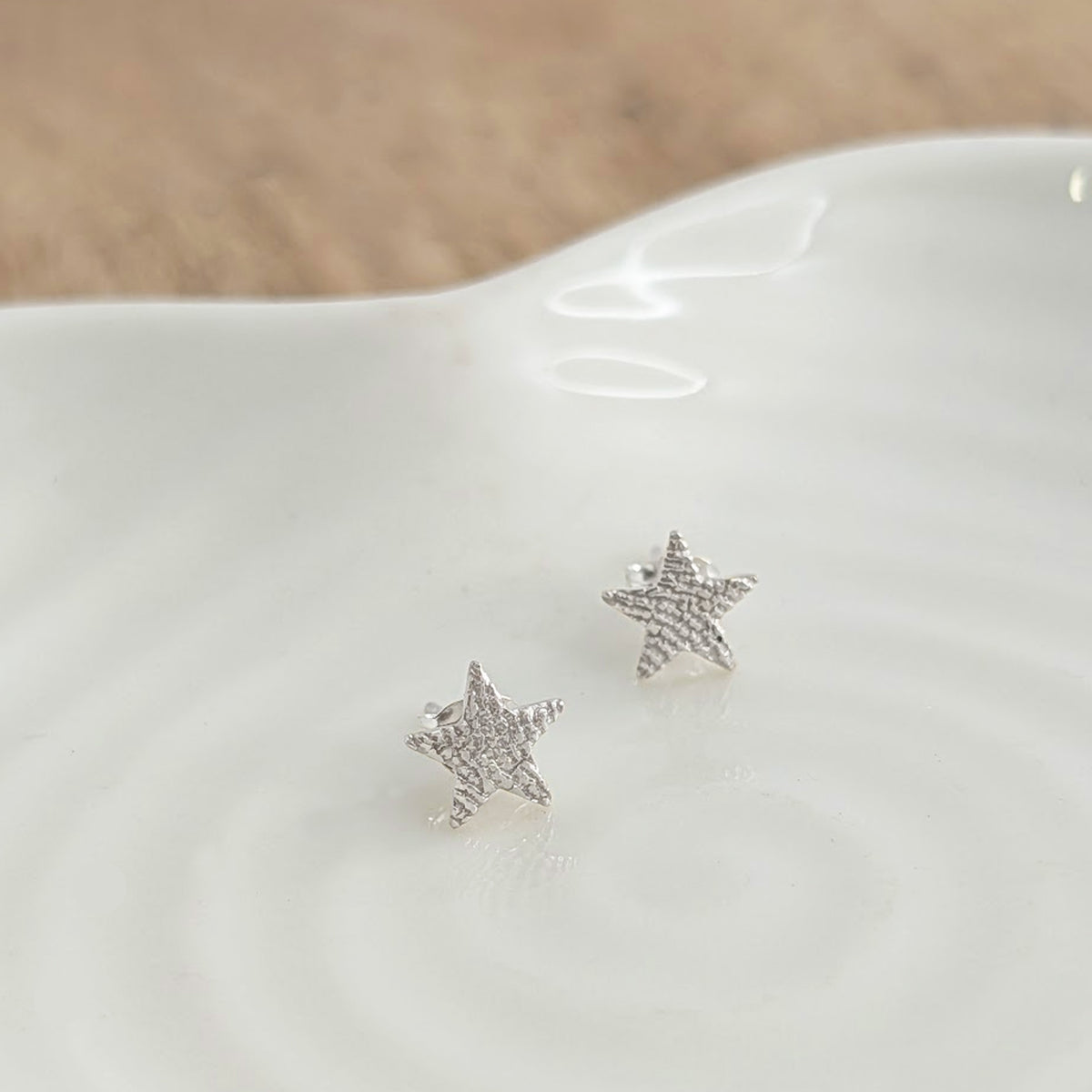 Handmade Fingerprint Star Studs – Elegant memorial and keepsake earrings engraved with a genuine fingerprint. Available in sterling silver or solid gold, creating a timeless piece of personalised jewellery.