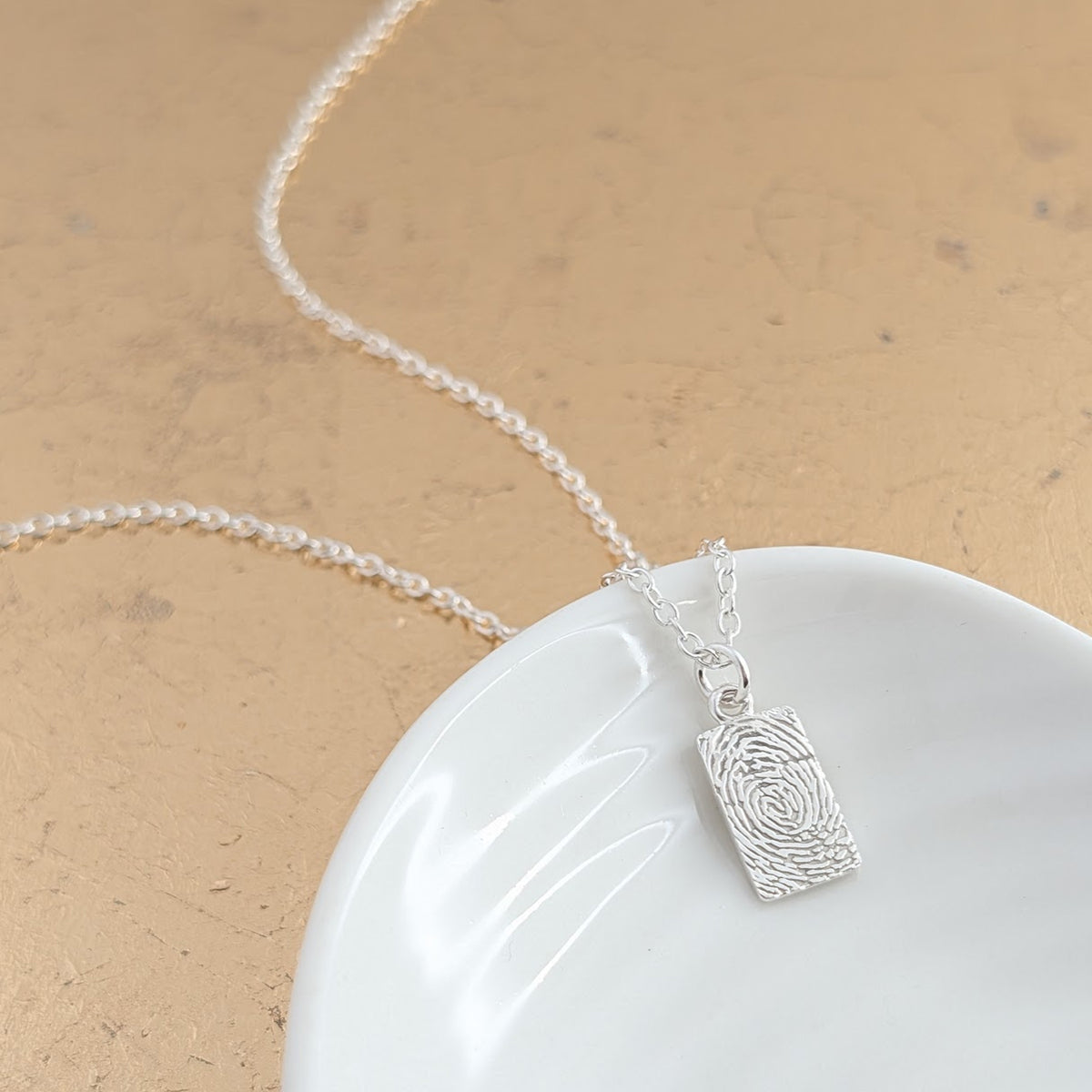 Fingerprint tag charm