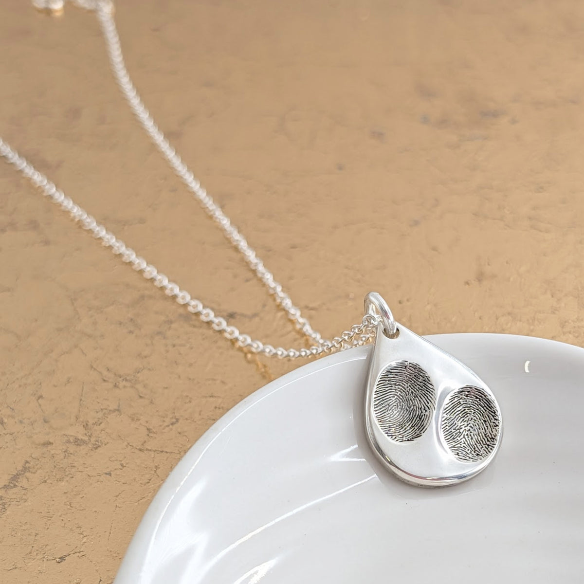 Double fingerprint memorial necklace handmade in Shropshire, UK


Details