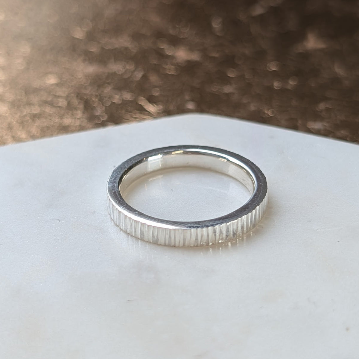 Handmade sterling silver bark texture ring with a slim profile, personalised fingerprint jewellery crafted in the UK.