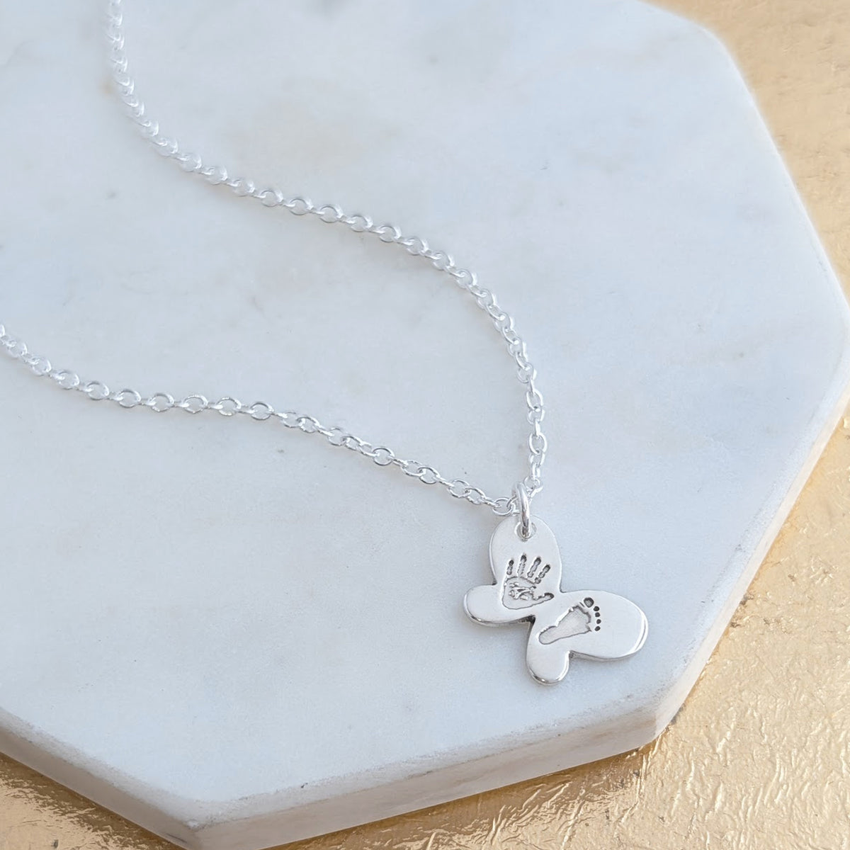 Baby handprint and footprint butterfly charm necklace in silver