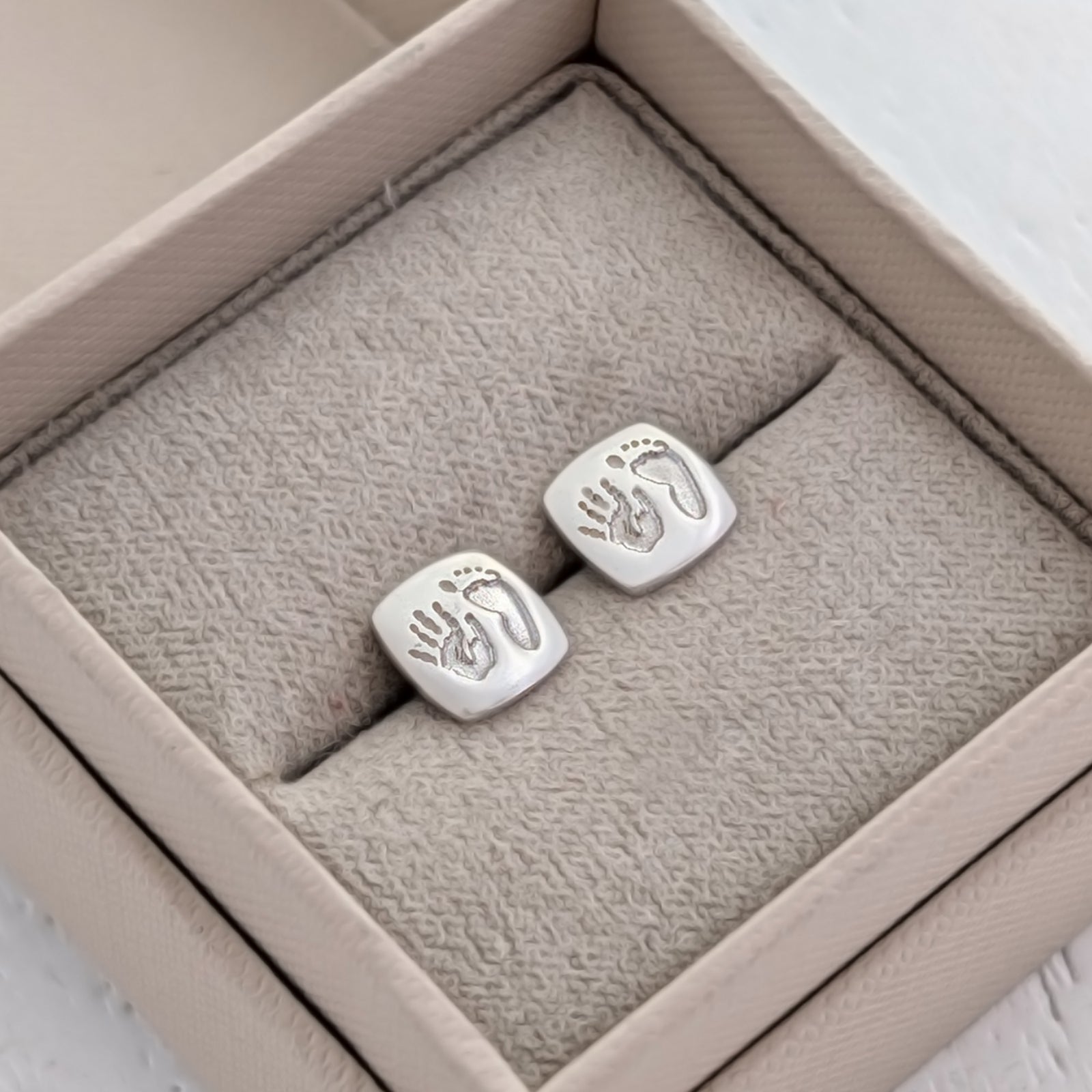 Personalised Handprint & Footprint Cushion Stud Earrings handcrafted in sterling silver or solid gold, capturing your baby's tiny handprint and footprint in beautiful detail.