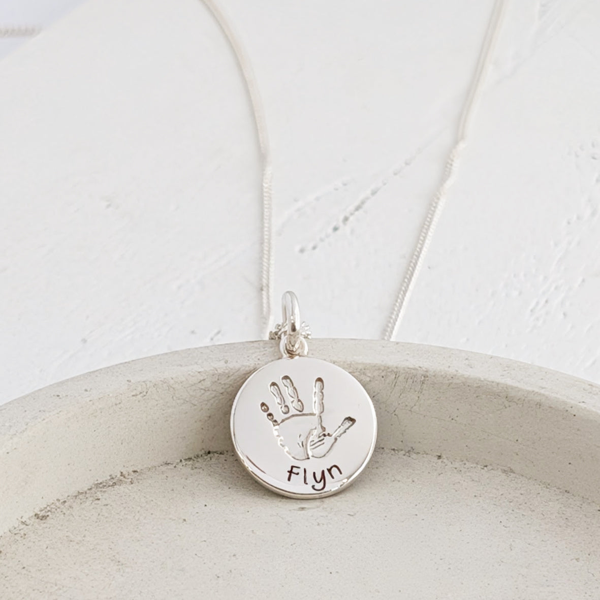 Baby handprint and footprint round charm with name