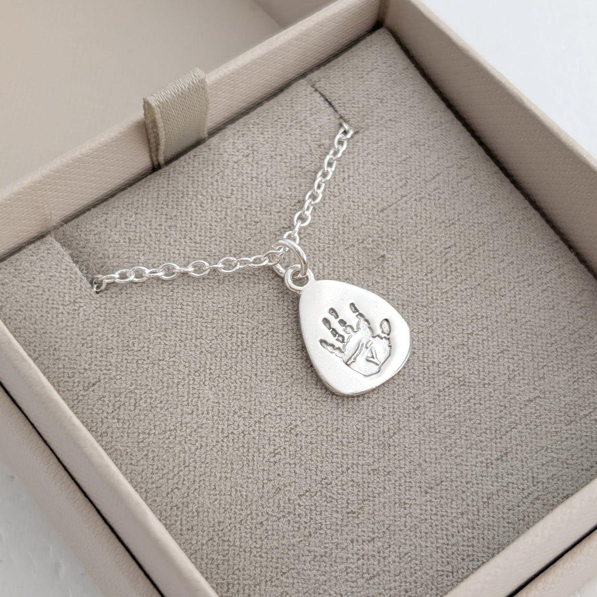 Gold or silver baby handprint and footprint charm necklace personalised with real newborn prints
