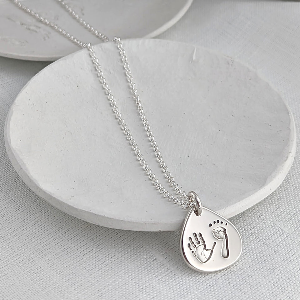 Baby handprint and footprint droplet necklace for mum in silver or gold