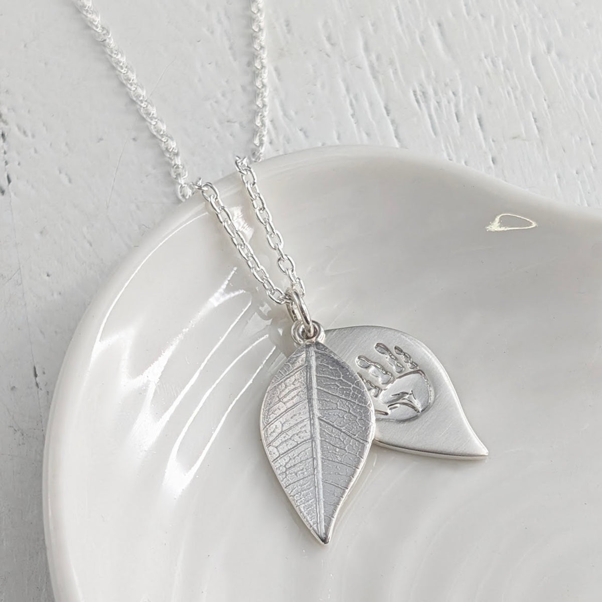 Leaf locket textured with real leaf and engraved with your childs handprint and footprint