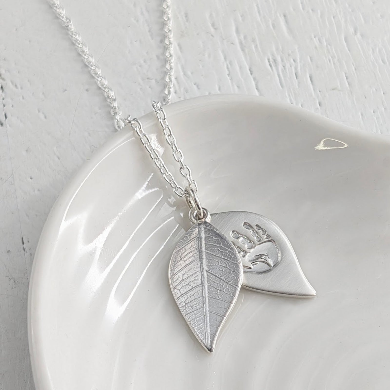 baby-handprint and footprint leaf locket necklace in solid gold