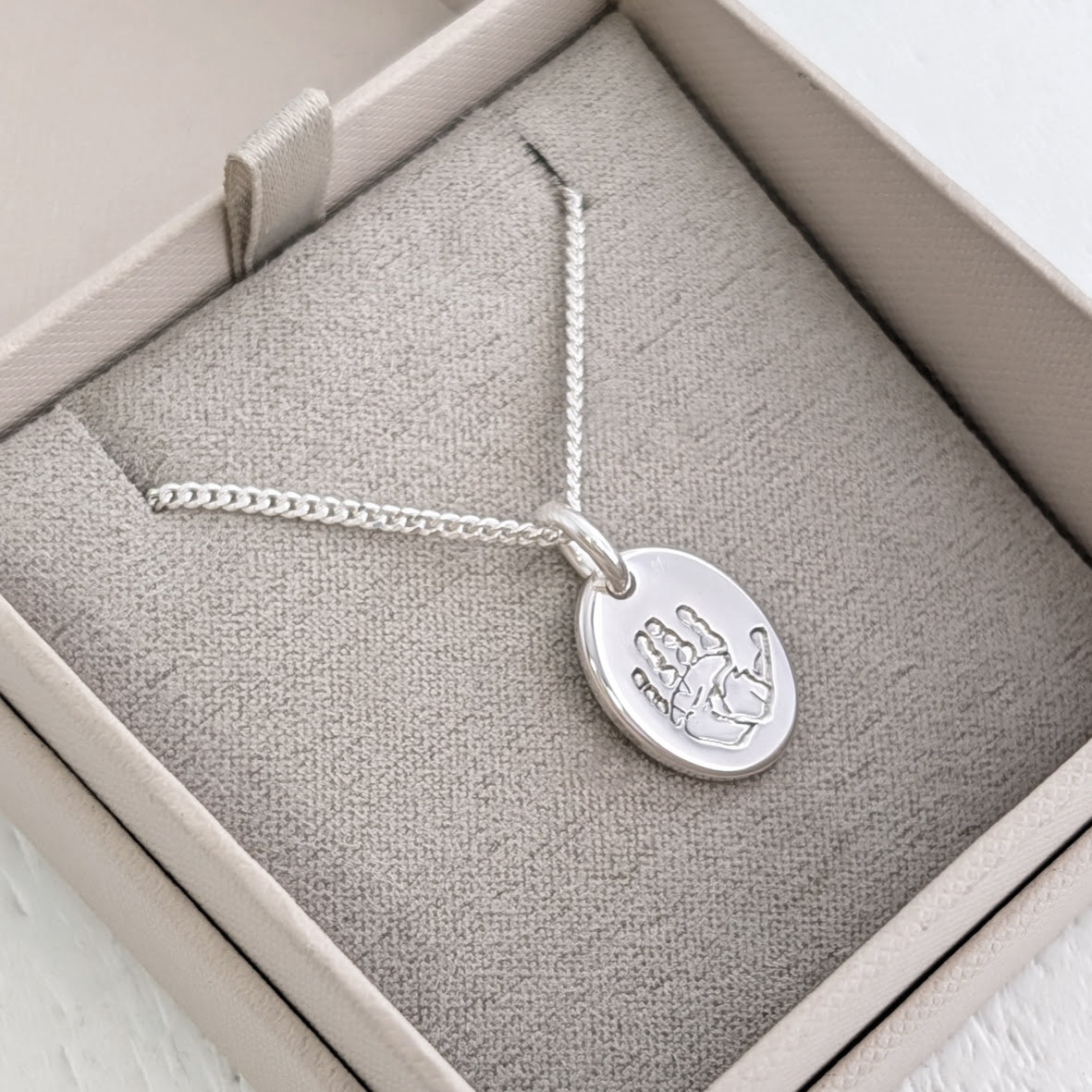 silver handprint charm 