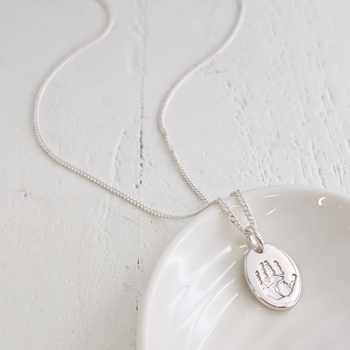 silver handprint charm 