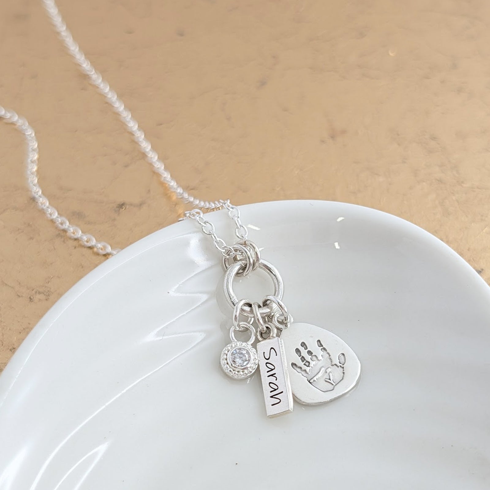 Sterling silver handprint or footprint droplet necklace with birthstone charm and little name tag
