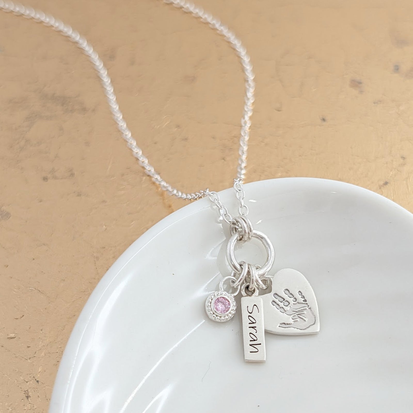 Sterling silver handprint or footprint heart necklace with birthstone charm and little name tag