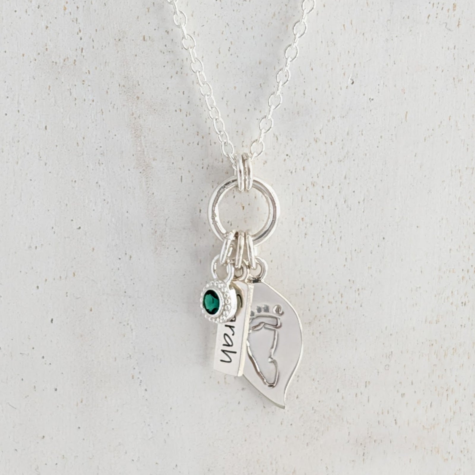 Leaf and nature nspired silver necklace engraved with child's own handprint or footprint and birthstone.