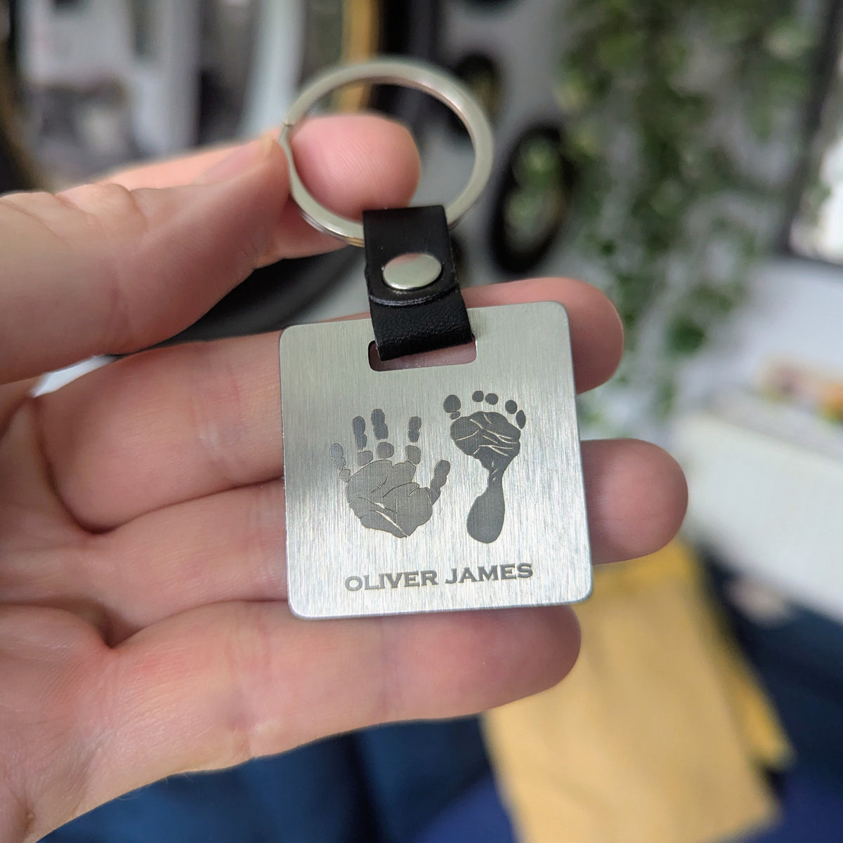 HAND &amp; FOOTPRINT STEEL SQUARE KEYRING