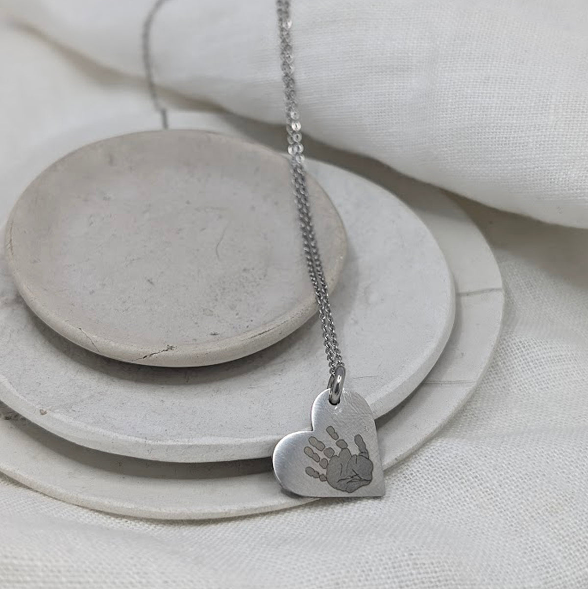 HANDPRINT STEEL HEART NECKLACE